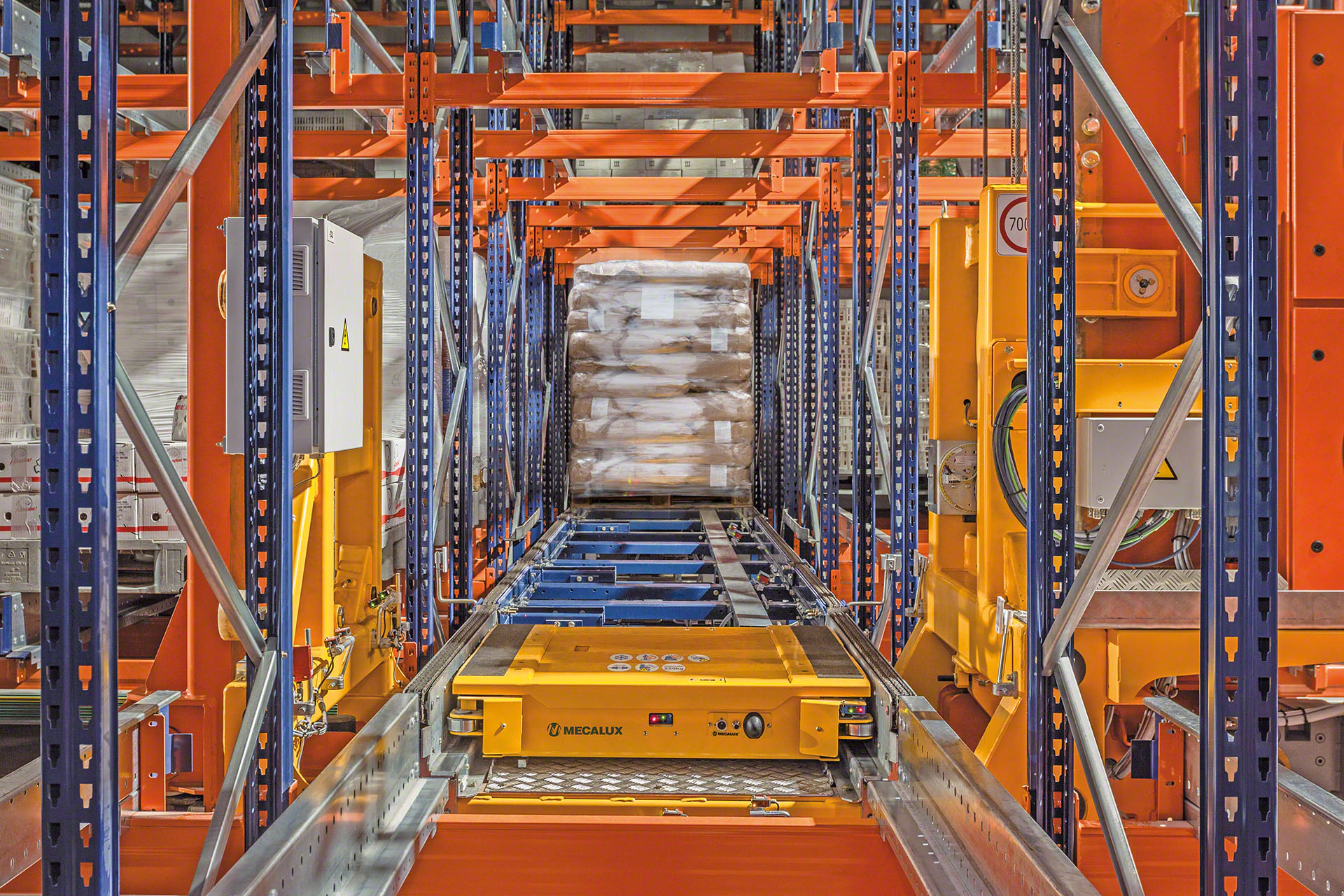 Automated warehouse shuttle system with orange racking