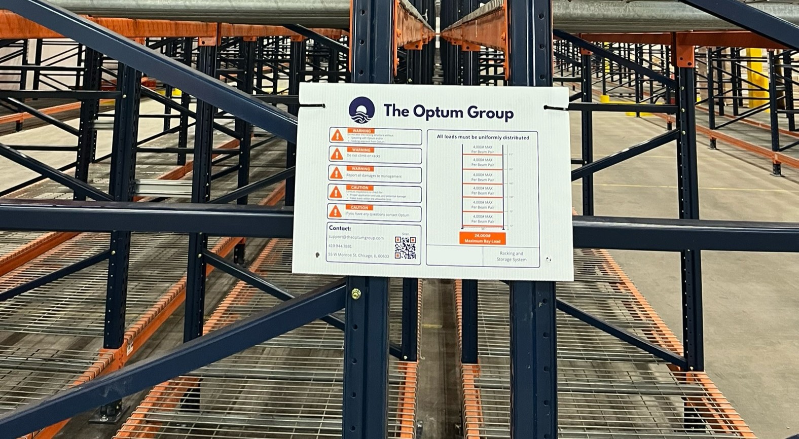 Racking system with Optum seismic placard showing engineering details