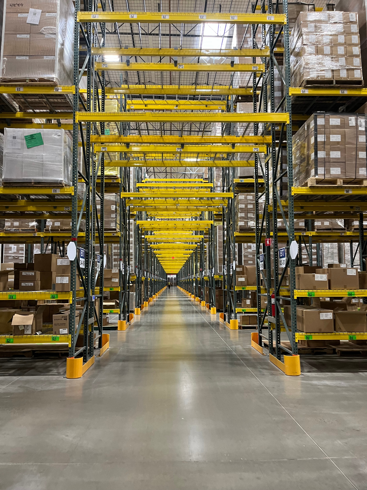 Warehouse aisle with yellow selective pallet racking